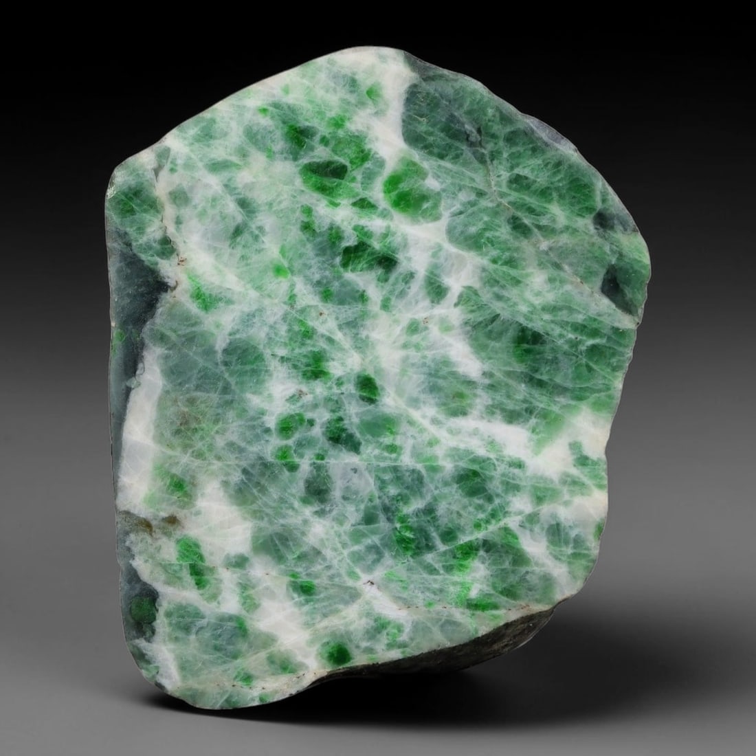 234ct Natural Type A Burmese Jadeite Jade Sliced Rough, 16YN: This specimen is a sliced rough block of natural Type A Burmese jadeite jade. The interior displays natural colour zoning with visible mineral veining and crystalline patterns typical of unprocessed j
