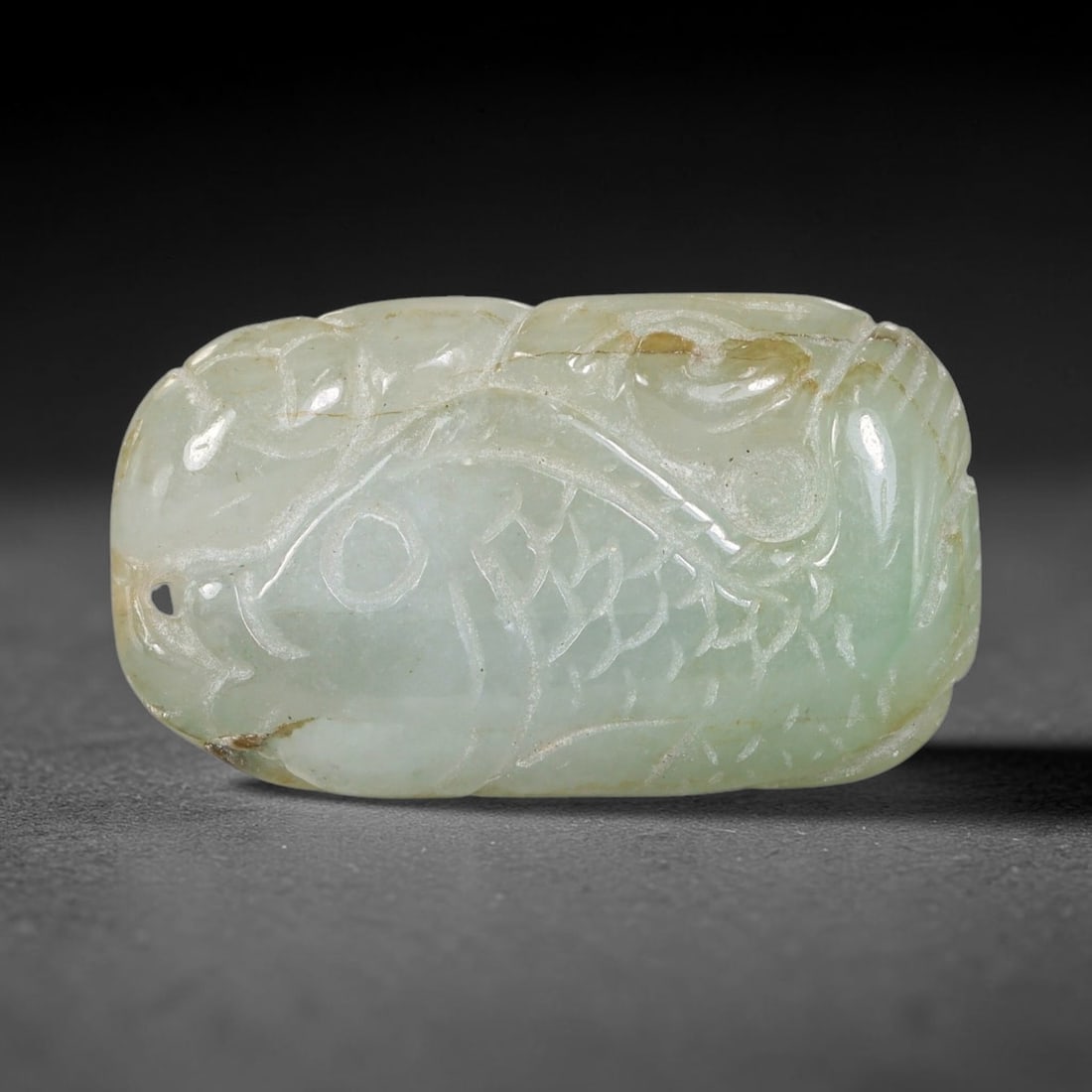 Natural Burmese Type A Jadeite Jade Hand Carved Pendant, 40TC: Artisan hand-carved untreated Burmese Type A jadeite jade pendant measuring 32x18.6 mm. Carefully sculpted with detailed relief craftsmanship and finished with a smooth glossy polish. Authentic Type A