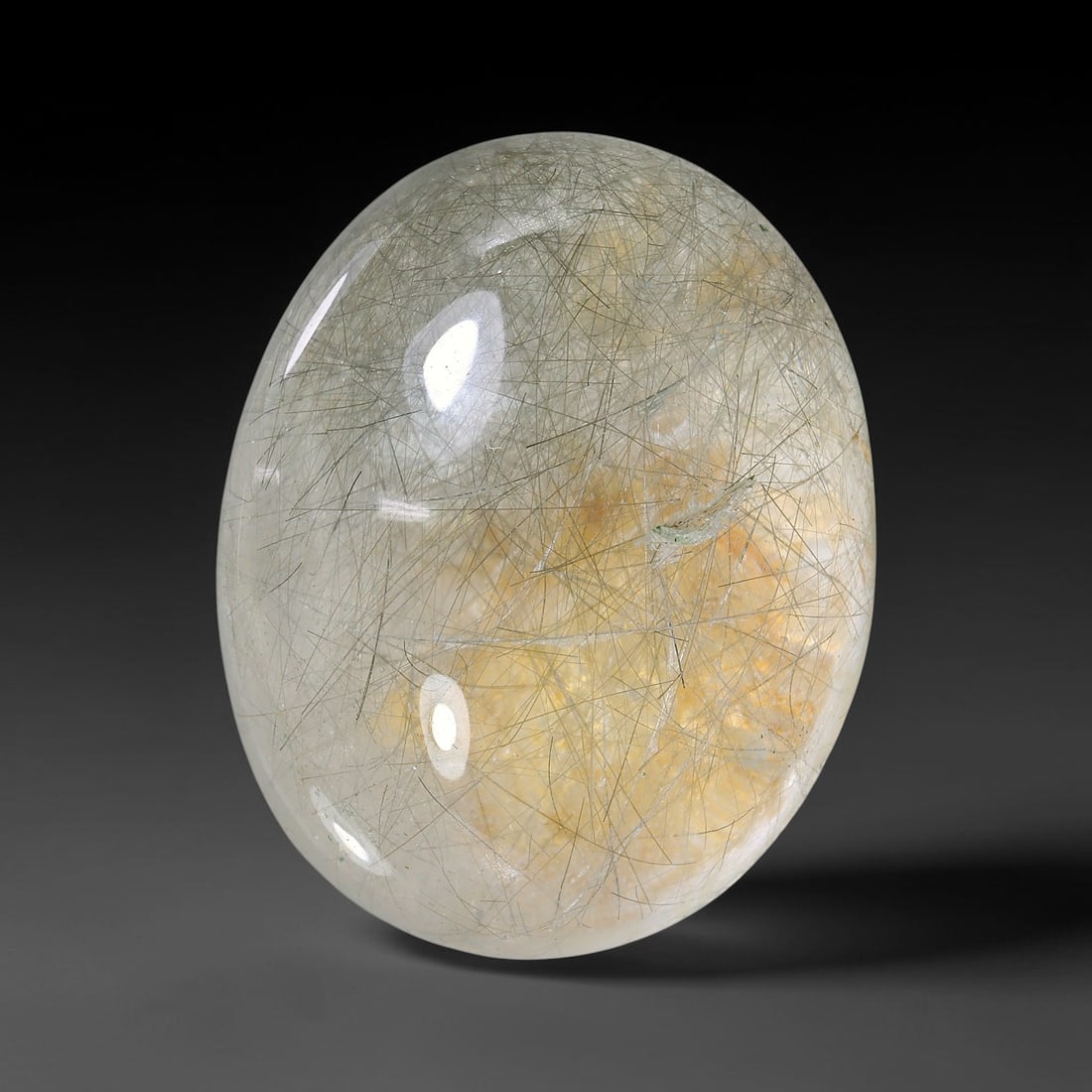 42.45ct Natural Brazilian Black Rutile Quartz Cabochon Loose Gemstone, 10YX: This polished cabochon of natural rutile quartz features countless distinct slender black rutile needle inclusions suspended within the clear quartz host crystal. The smooth domed surface enables full