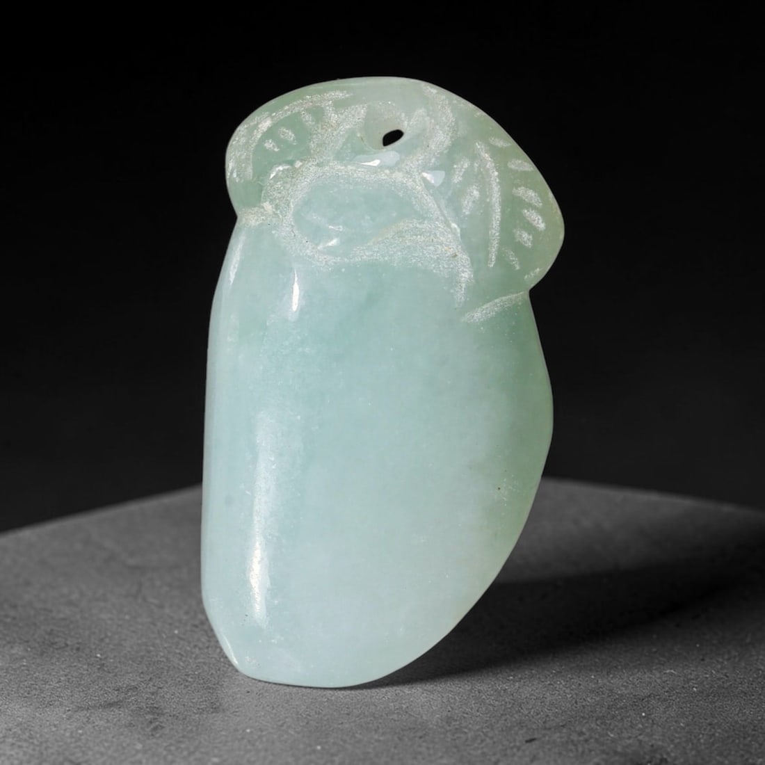 Natural Burmese Type A Jadeite Jade Hand Carved Pendant, 18TC: Artisan hand-carved untreated Burmese Type A jadeite jade pendant measuring 28.7x17 mm. Carefully sculpted with detailed relief craftsmanship and finished with a smooth glossy polish. Authentic Type A