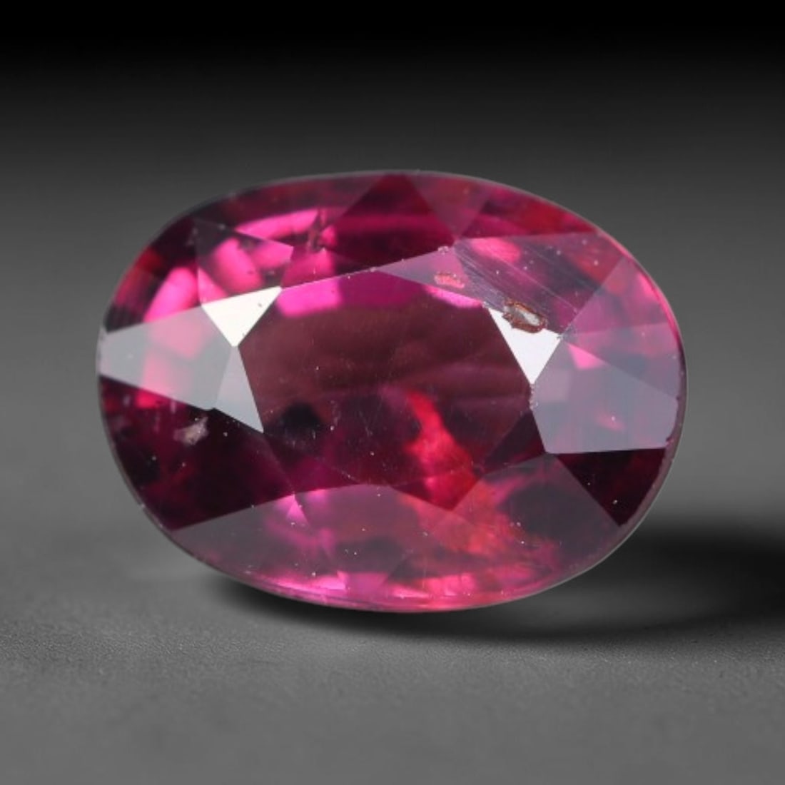 1.04 Carats Natural Rich Magenta Red Garnet Oval Faceted Loose Gemstone, 38WW: This garnet originates from natural geological mineral deposits and undergoes precise faceting and high-gloss reflective polishing via professional lapidary craftsmanship. Minute pinpoint mineral spec
