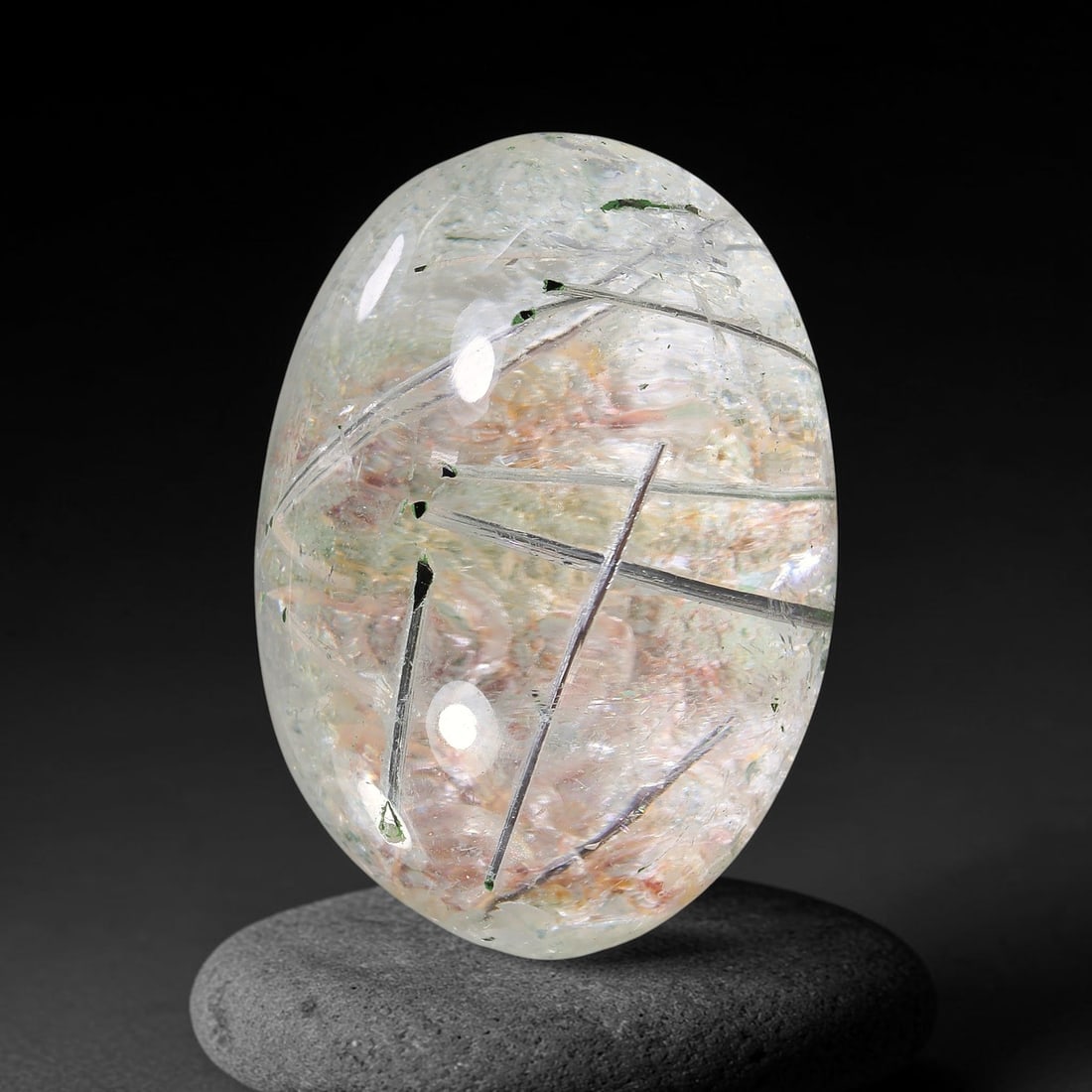 29.29ct Natural Brazilian Black Rutile Quartz Cabochon Loose Gemstone, 3YX: This polished cabochon of natural rutile quartz features countless distinct slender black rutile needle inclusions suspended within the clear quartz host crystal. The smooth domed surface enables full