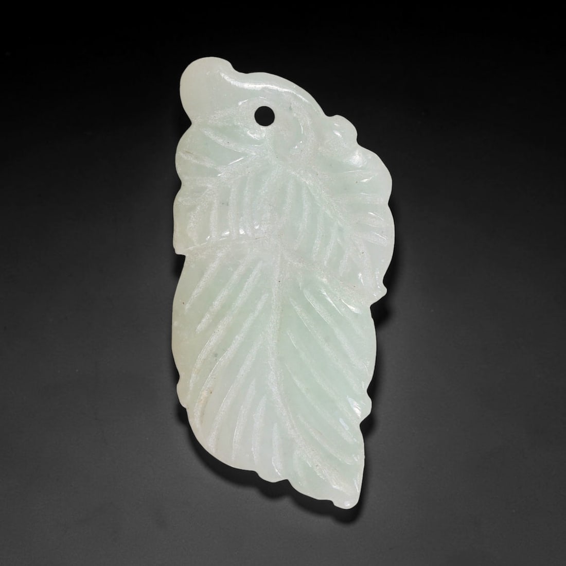 Natural Burmese Type A Jadeite Jade Hand Carved Pendant, 28TC: Artisan hand-carved untreated Burmese Type A jadeite jade pendant measuring 40x19 mm. Carefully sculpted with detailed relief craftsmanship and finished with a smooth glossy polish. Authentic Type A j