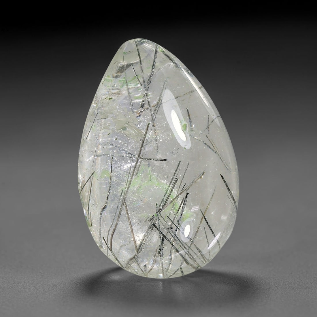 19.43ct Natural Brazilian Black Rutile Quartz Cabochon Loose Gemstone, 4YX: This polished cabochon of natural rutile quartz features countless distinct slender black rutile needle inclusions suspended within the clear quartz host crystal. The smooth domed surface enables full