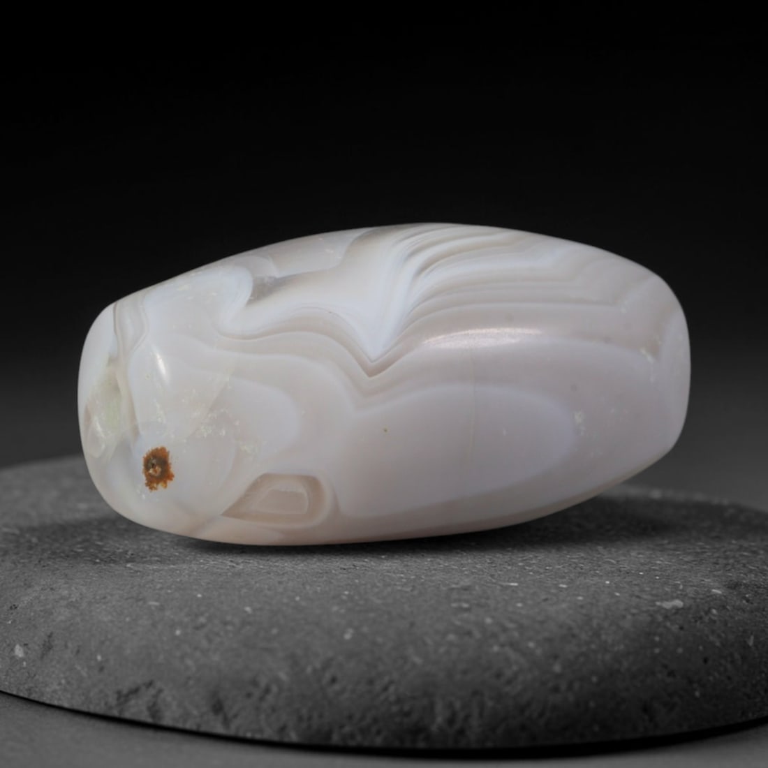 Ancient Sasanian Persian Empire Banded Agate Barrel Bead (224-651 CE), 80XD: This antique banded agate barrel bead originates from the Sasanian Persian Empire, the late antique West Asian civilization celebrated for crafting fine layered agate talismans intended for Zoroastria
