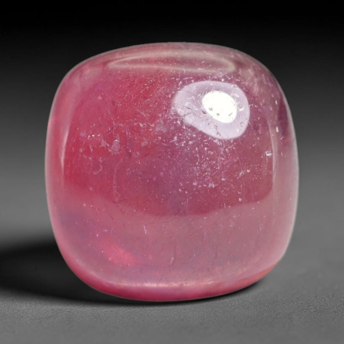 8.20 Carats Natural Mozambique Ruby Cabochon Loose Gemstone, 13XX: This ruby originates from Mozambique natural mineral deposits and receives professional cabochon grinding and polishing treatment to form a smooth glossy exterior surface. Tiny mineral particles and n