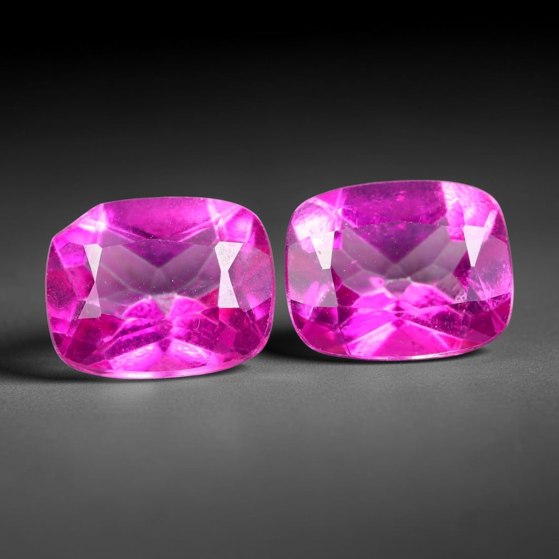 7.04ct Natural Pink Topaz Cushion Cut Matched Pair Loose Gemstones, 88TG: Natural pink topaz fashioned into a matched pair of cushion mixed cuts with polished table and brilliant pavilion facets. The stones display a saturated vivid hot pink body color with excellent transp