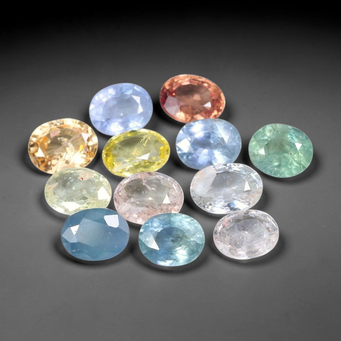 3.99ct Natural Fancy Color Sapphire Oval Mixed Cut Loose Gemstone, 3TH: Fancy color sapphire faceted into a compact oval mixed cut with polished table and pavilion facets. The stone displays a soft pastel green body color with good light return and subtle internal silk in
