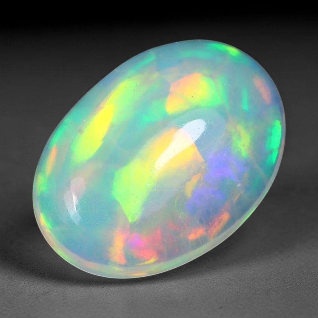 2.54ct Natural Multicolor Fire Ethiopian Welo Solid Opal Cabochon Loose Gemstone, 29TG: Formed from natural silica deposits within Ethiopian mineral veins, this solid opal cabochon is polished to a smooth domed surface that displays inherent light refraction traits. The stone carries wid