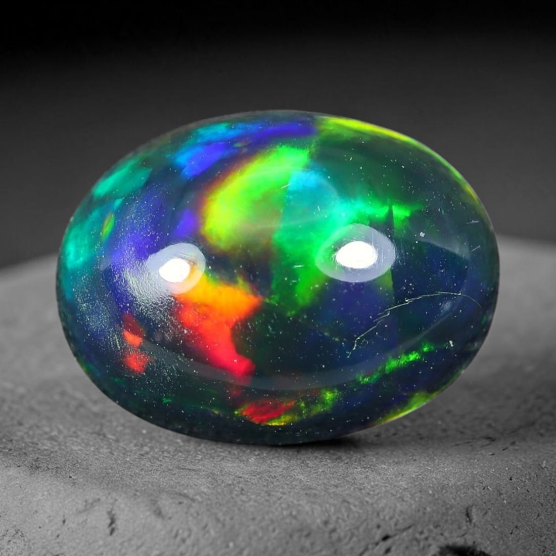 2.34ct Natural Ethiopian Welo Black Smoked Opal Cabochon Loose Gemstone, 78TG: This fully polished Ethiopian Welo opal features a dark smoked base with vivid, sweeping play-of-color shifting across its glossy dome surface, measured at 10.8x8.5x5.4mm. The black smoke treatment de