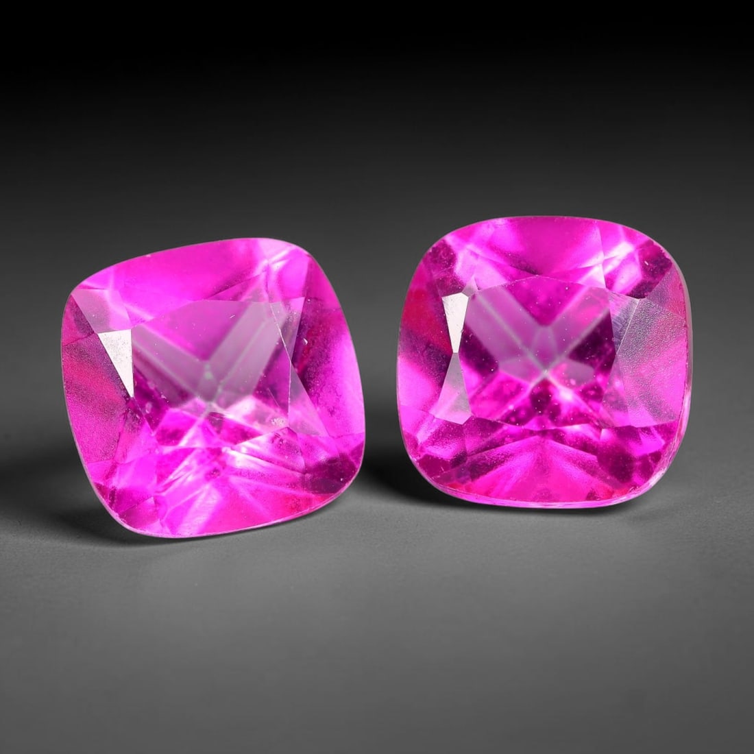 5.62ct Natural Pink Topaz Cushion Cut Matched Pair Loose Gemstones, 95TG: Natural pink topaz fashioned into a matched pair of cushion brilliant cuts with polished table and symmetrical pavilion facets. The stones exhibit a saturated vivid hot pink body color with high trans