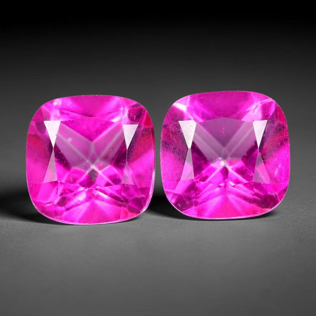 5.27ct Natural Pink Topaz Cushion Cut Matched Pair Loose Gemstones, 87TG: Natural pink topaz fashioned into a matched pair of cushion brilliant cuts with polished table and symmetrical pavilion facets. The stones exhibit a saturated vivid hot pink body color with high trans