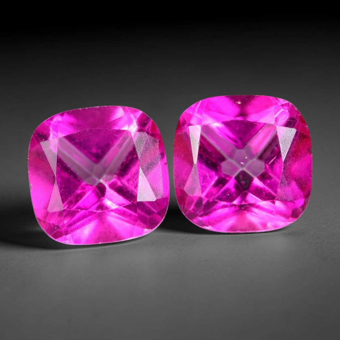 4.92ct Natural Pink Topaz Cushion Cut Matched Pair Loose Gemstones, 1TH: Natural pink topaz fashioned into a matched pair of cushion brilliant cuts with polished table and symmetrical pavilion facets. The stones exhibit a saturated vivid hot pink body color with high trans
