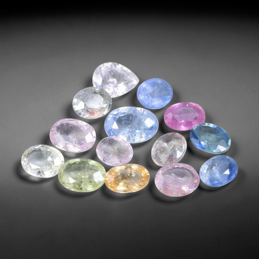 4.39ct Natural Fancy Color Sapphire Oval Mixed Cut Loose Gemstone, 4TH: Fancy color sapphire faceted into a compact oval mixed cut with polished table and pavilion facets. The stone displays a soft pastel green body color with good light return and subtle internal silk in