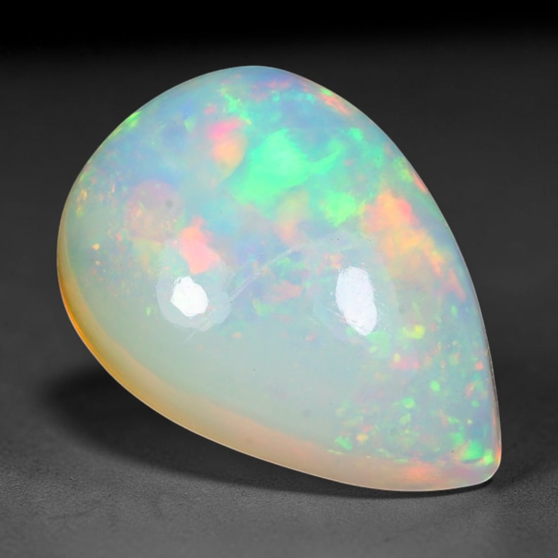 3.50ct Natural Ethiopian Welo Solid Opal Oval Cabochon Loose Gemstone, 34TG: Solid opal cabochon mined from Ethiopia's Welo opal deposits, polished into a smooth elongated oval dome with high reflective gloss. The translucent pale milky base hosts broad shifting play-of-color 