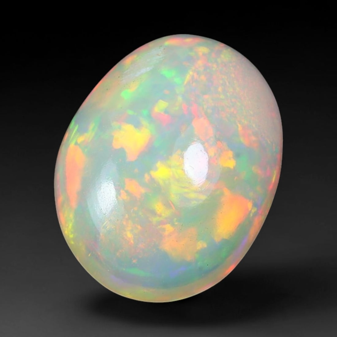 2.45ct Natural Multicolor Fire Ethiopian Welo Solid Opal Cabochon Loose Gemstone, 24TG: Formed from natural silica deposits within Ethiopian mineral veins, this solid opal cabochon is polished to a smooth domed surface that displays inherent light refraction traits. The stone carries wid