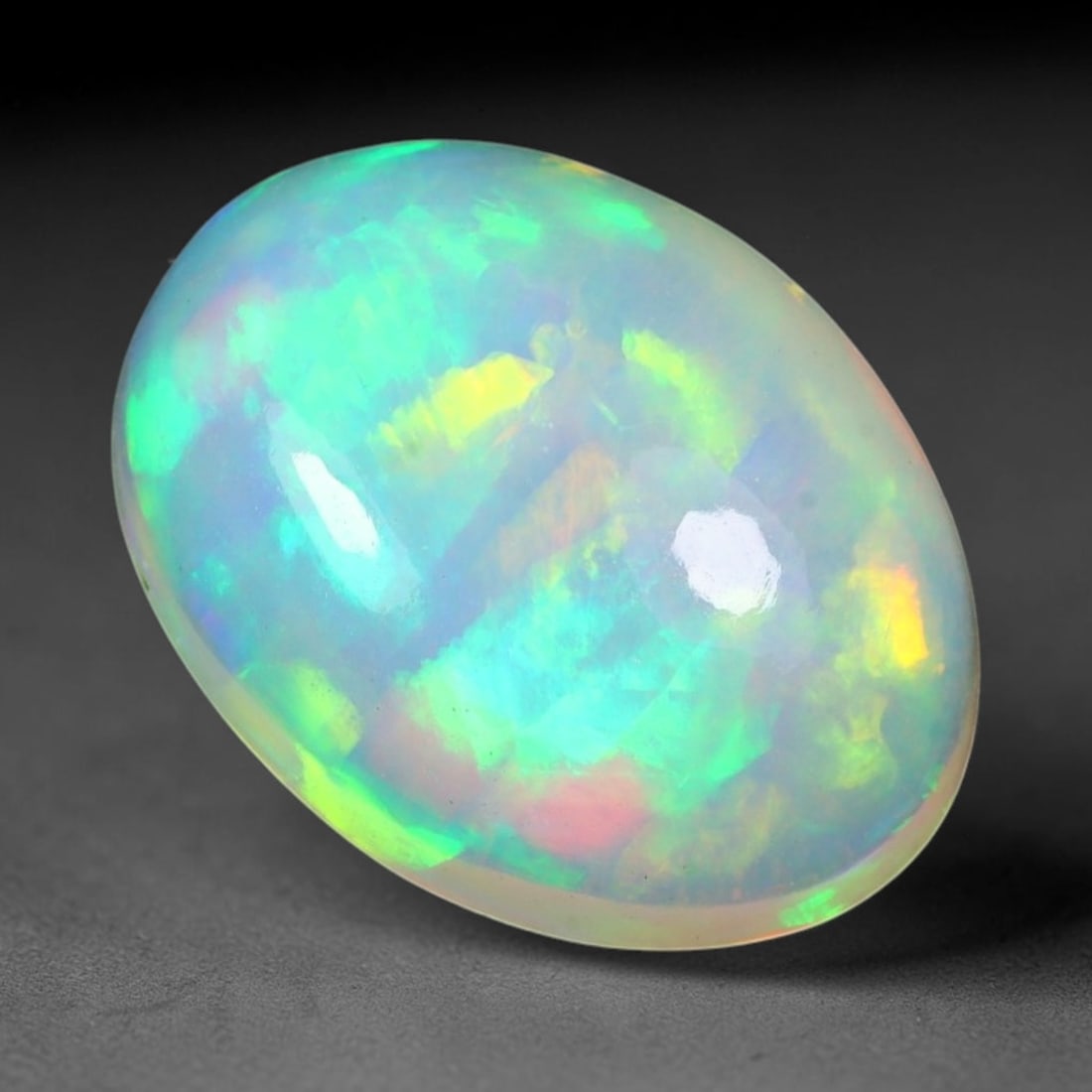 2.92ct Natural Multicolor Fire Ethiopian Welo Solid Opal Cabochon Loose Gemstone, 25TG: Formed from natural silica deposits within Ethiopian mineral veins, this solid opal cabochon is polished to a smooth domed surface that displays inherent light refraction traits. The stone carries wid