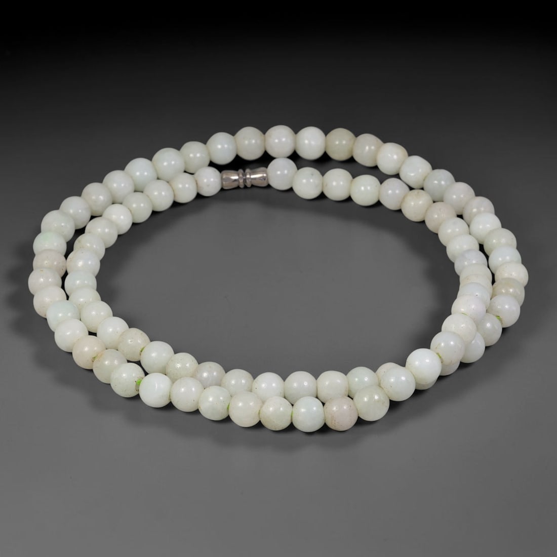 Natural Burmese Type A White Jadeite Jade Round Bead Necklace, 38TF: Polished from natural Burmese Type A jadeite, this necklace features smooth round white jadeite beads measuring 8.8mm, finished with a metal screw clasp. It exhibits soft milky white tones with subtle