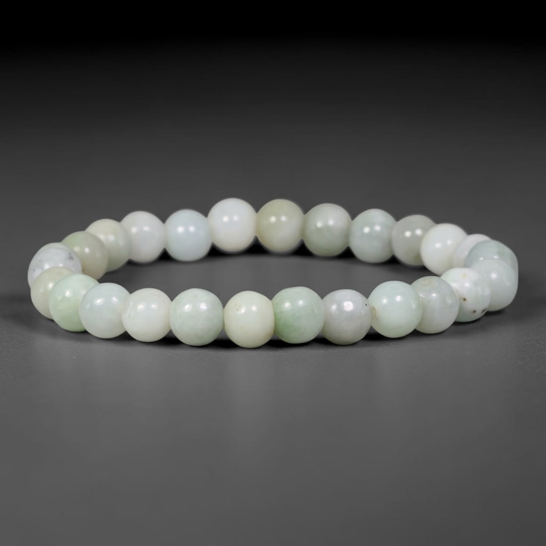 Natural Burmese Type A Jadeite Jade Pale Green Round Bead Bracelet, 89TK: Polished from natural Burmese Type A jadeite, this bracelet features smooth round pale green beads measuring 8.7mm. It has soft pale green and milky white tones with gentle natural clouding and subtle