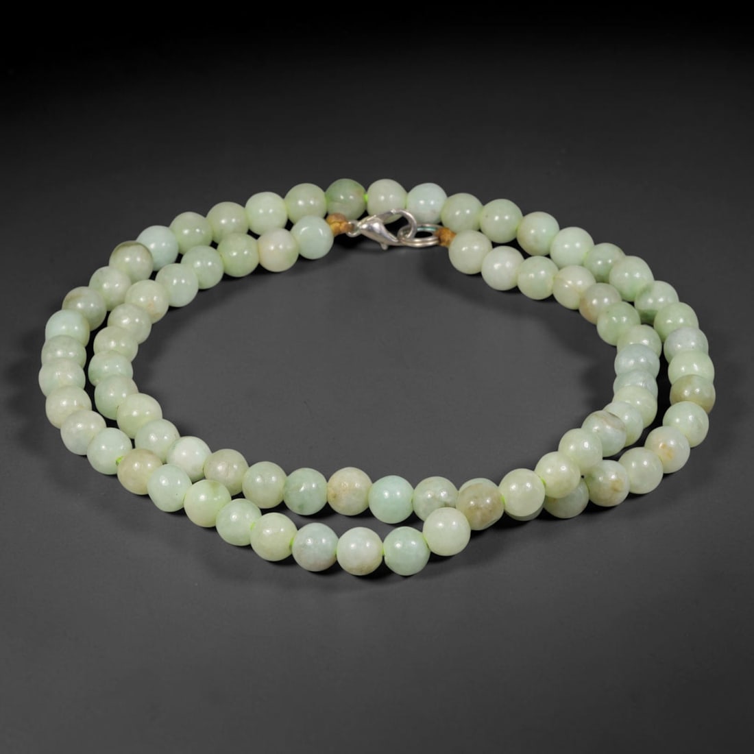 Natural Burmese Type A Pale Celadon Jadeite Jade Round Bead Necklace, 35TF: Polished from natural Burmese Type A jadeite, this necklace features smooth round pale celadon jadeite beads measuring 7.2mm, completed with a metal lobster clasp. It showcases gentle pale celadon ton