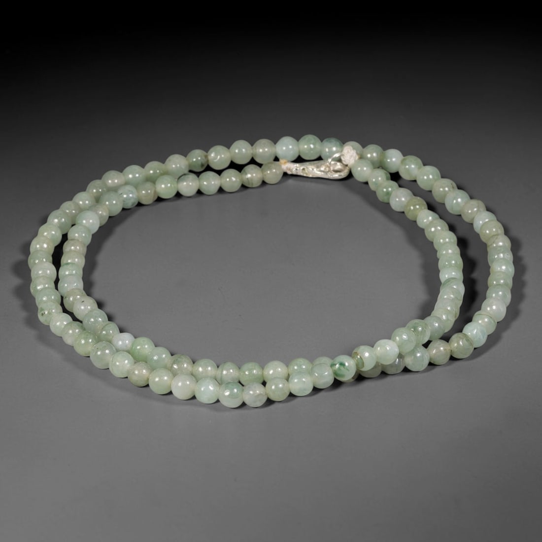 Natural Burmese Type A Soft Pale Green Jadeite Jade Bead Necklace, 14TF: Smooth round natural Burmese Type A jadeite beads measuring 5.7mm, with soft pale sage-green hues and subtle natural tone variation throughout the strand. Equipped with a sterling silver lobster clasp