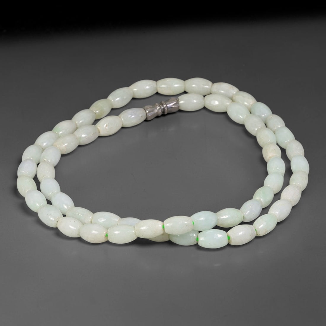 Natural Burmese Type A Pale White Oval Jadeite Jade Bead Necklace, 12TF: Smooth oval rice-shaped natural Burmese Type A jadeite beads measuring 6.0mm, featuring soft milky pale white with faint natural tonal variations. Completed with a metal screw barrel clasp. Untreated 