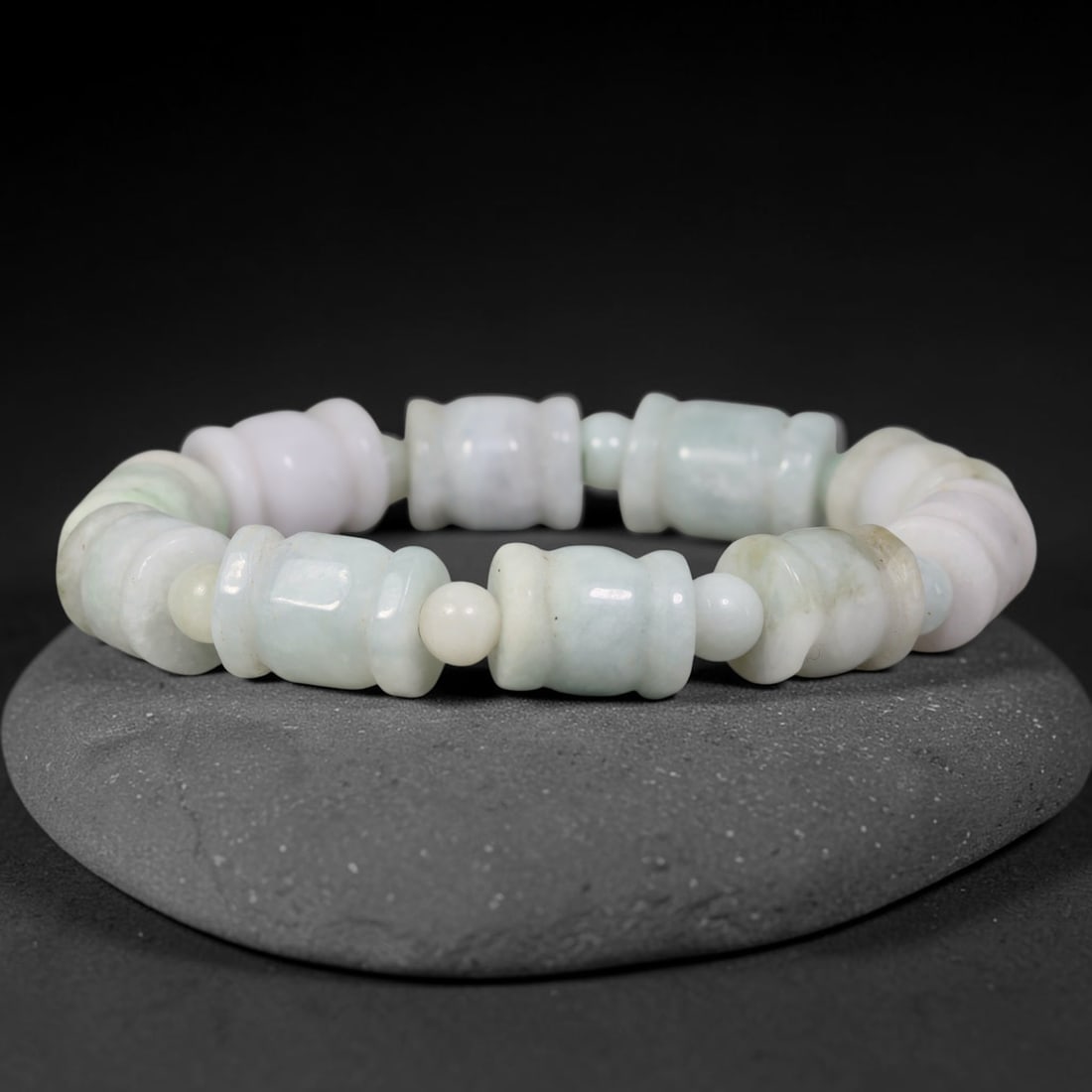 Natural Burmese Type A Pale Celadon Barrel Shape Jadeite Jade Bead Bracelet, 75TK: Polished from natural Burmese Type A jadeite, this bracelet features carved pale celadon barrel shape beads measuring 11.7mm, separated by small round jadeite spacer beads. It presents soft milky whit
