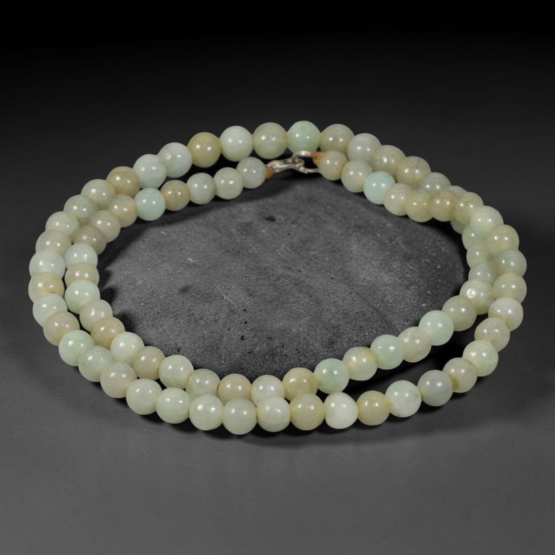 Natural Burmese Type A Pale Celadon Jadeite Jade Beaded Necklace, 3TF: Strung from untreated natural Burmese Type A jadeite jade spherical beads measuring 8.2mm in diameter, this full strand features a uniform smooth polished finish showcasing soft pale celadon mineral h