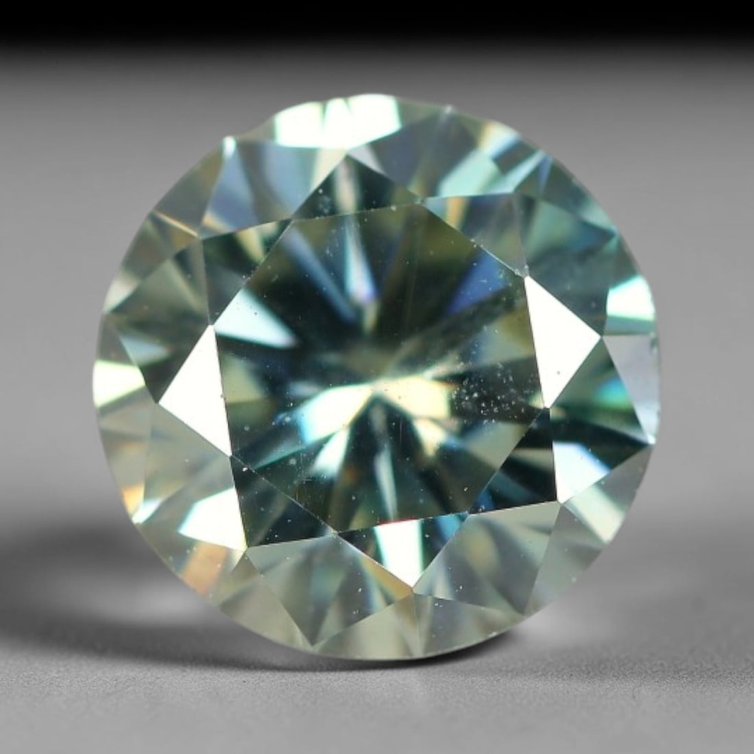 2.10 Carats Clear Moissanite Loose Gemstone, 75WP: This moissanite features dimensional measurements of 8.4x5mm, a lab-created silicon carbide gem material celebrated for an impressive refractive index that creates intense light dispersion and dynamic