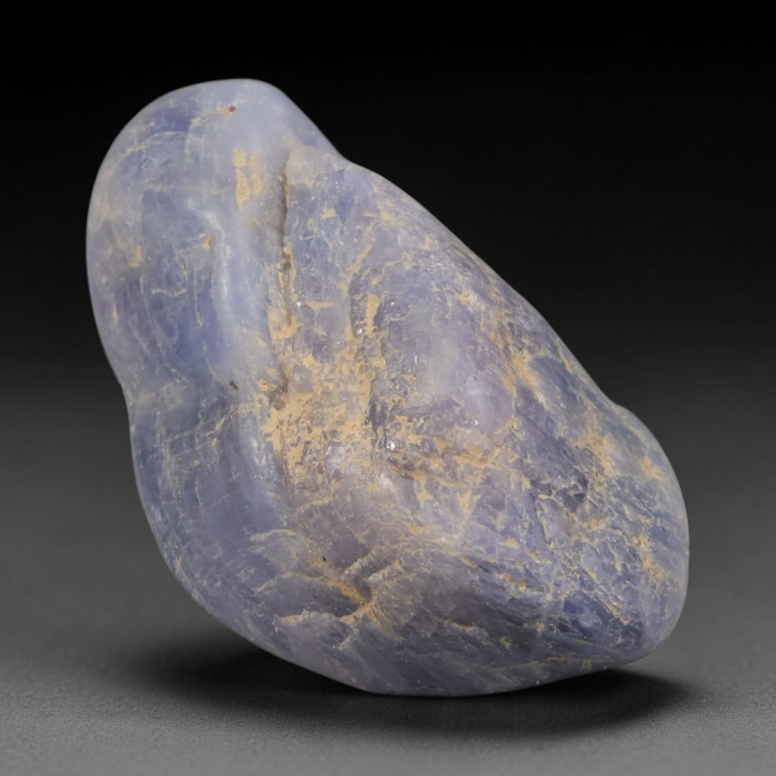 33ct Natural Unheated Sri Lankan Purplish Blue Sapphire Rough, 49YQ: This natural corundum rough is an unheated purplish blue sapphire sourced from Sri Lankan alluvial gem deposits, featuring an irregular natural native form with residual pale yellow-brown mineral matr