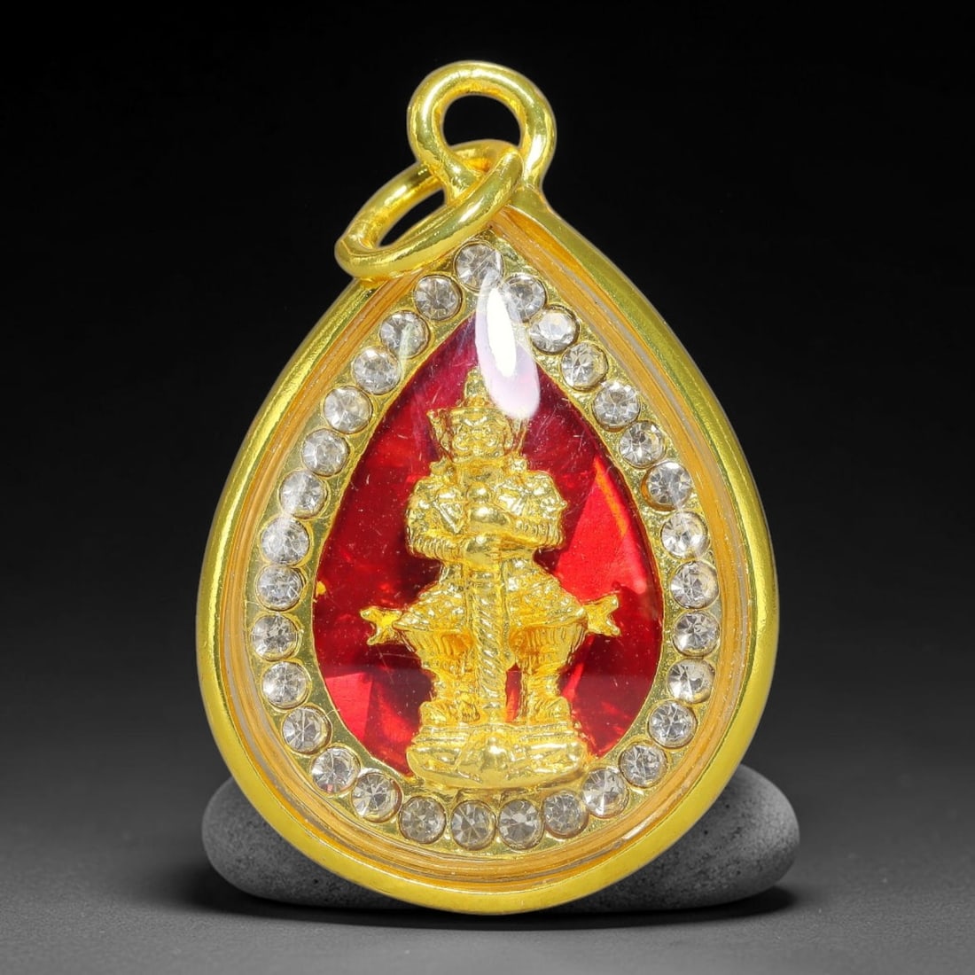 Thai Thao Wessuwan Giant God Dual-Sided Gold Plated Rhinestone Casing Amulet, 78YY: Mini teardrop-shaped Thai Thao Wessuwan amulet with gold metal core sealed under transparent protective cover, set within polished gold-plated teardrop frame lined with full circle clear rhinestones, 