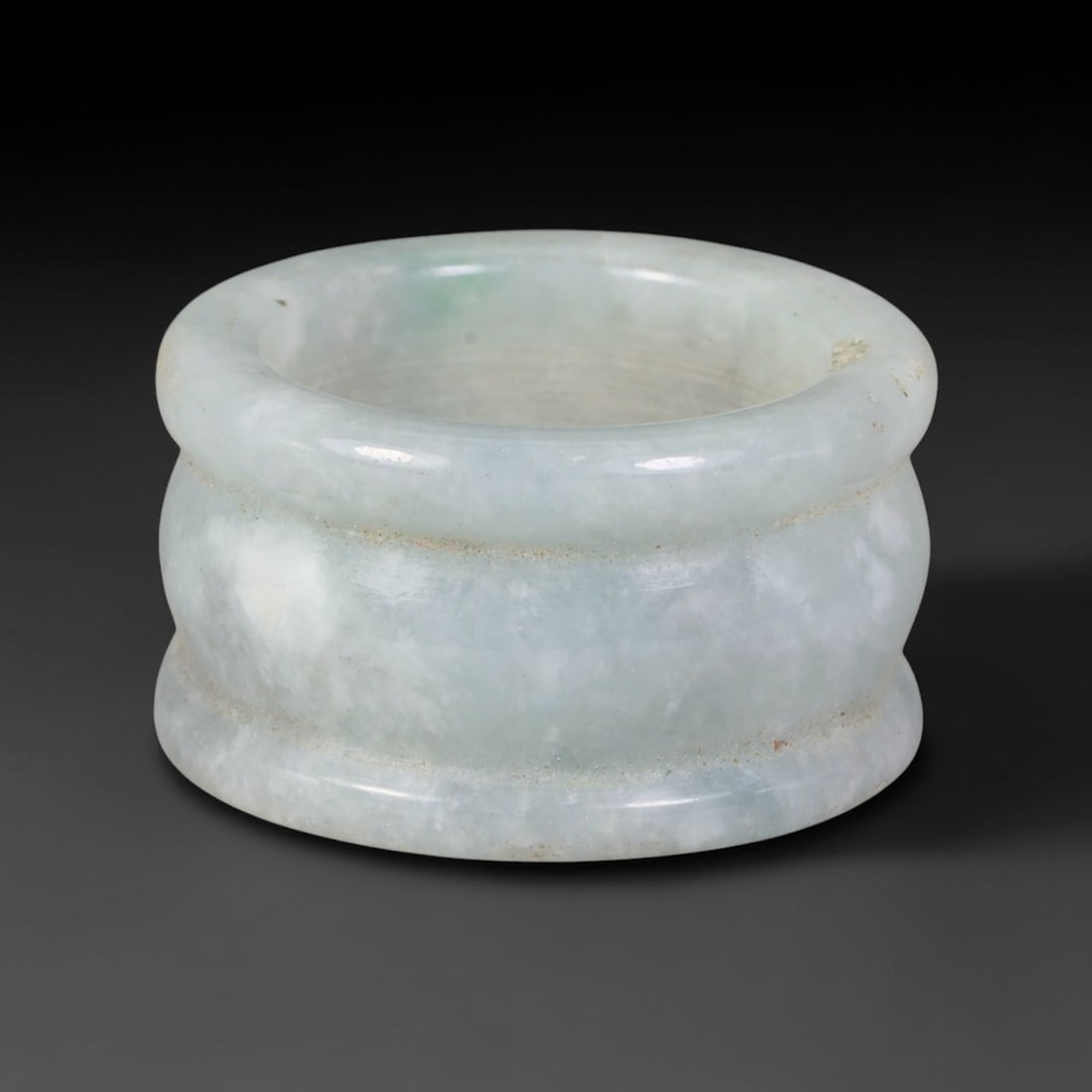 Natural Burmese Type A Jadeite Jade Band Ring Size US 9.50, 5TB: Fashioned from untreated natural Burmese Type A jadeite jade, this solid stone band carries a smooth polished finish showcasing milky pale base tones blended with soft natural green mineral undertones