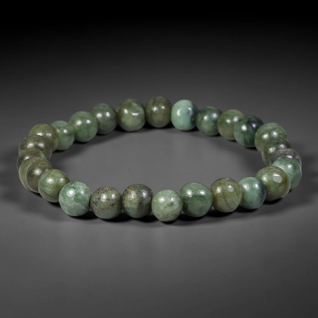 Natural Burmese Type A Vintage Mottled Green Jadeite Jade Beaded Bracelet, 68TA: This bracelet is handcrafted from fully untreated authentic Burmese Type A jadeite, composed of evenly polished smooth round beads featuring natural vintage green base tones interspersed with dark min