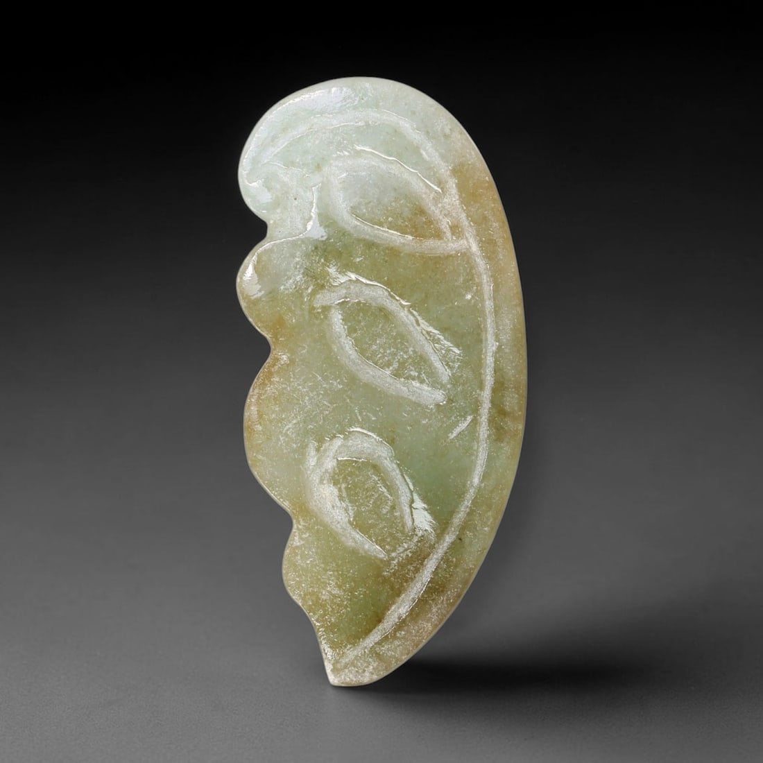 Natural Burmese Type A Jadeite Jade Hand Carved Pendant, 25TC: Artisan hand-carved untreated Burmese Type A jadeite jade pendant measuring 34.5x16 mm. Carefully sculpted with detailed relief craftsmanship and finished with a smooth glossy polish. Authentic Type A