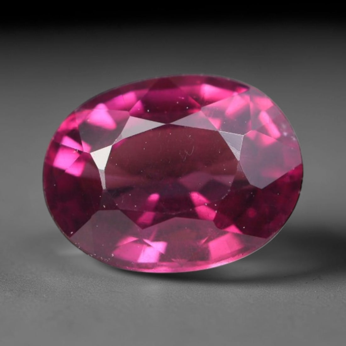 1.67 Carats Natural Rich Magenta Red Garnet Oval Faceted Loose Gemstone, 47WW: This garnet originates from natural geological mineral deposits and undergoes precise faceting and high-gloss reflective polishing via professional lapidary craftsmanship. Minute pinpoint mineral spec