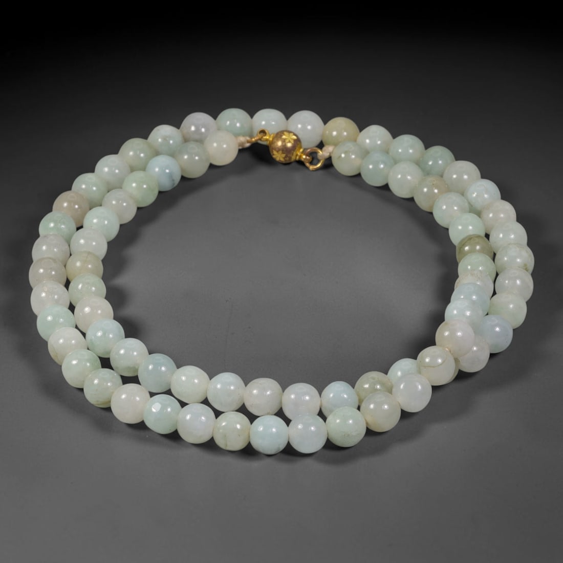 Natural Burmese Type A Pale Celadon Jadeite Jade Beaded Necklace, 2TF: Strung from untreated natural Burmese Type A jadeite jade spherical beads measuring 8.85mm in diameter, this full strand displays a smooth uniform polished finish with soft pale celadon stone tones ac
