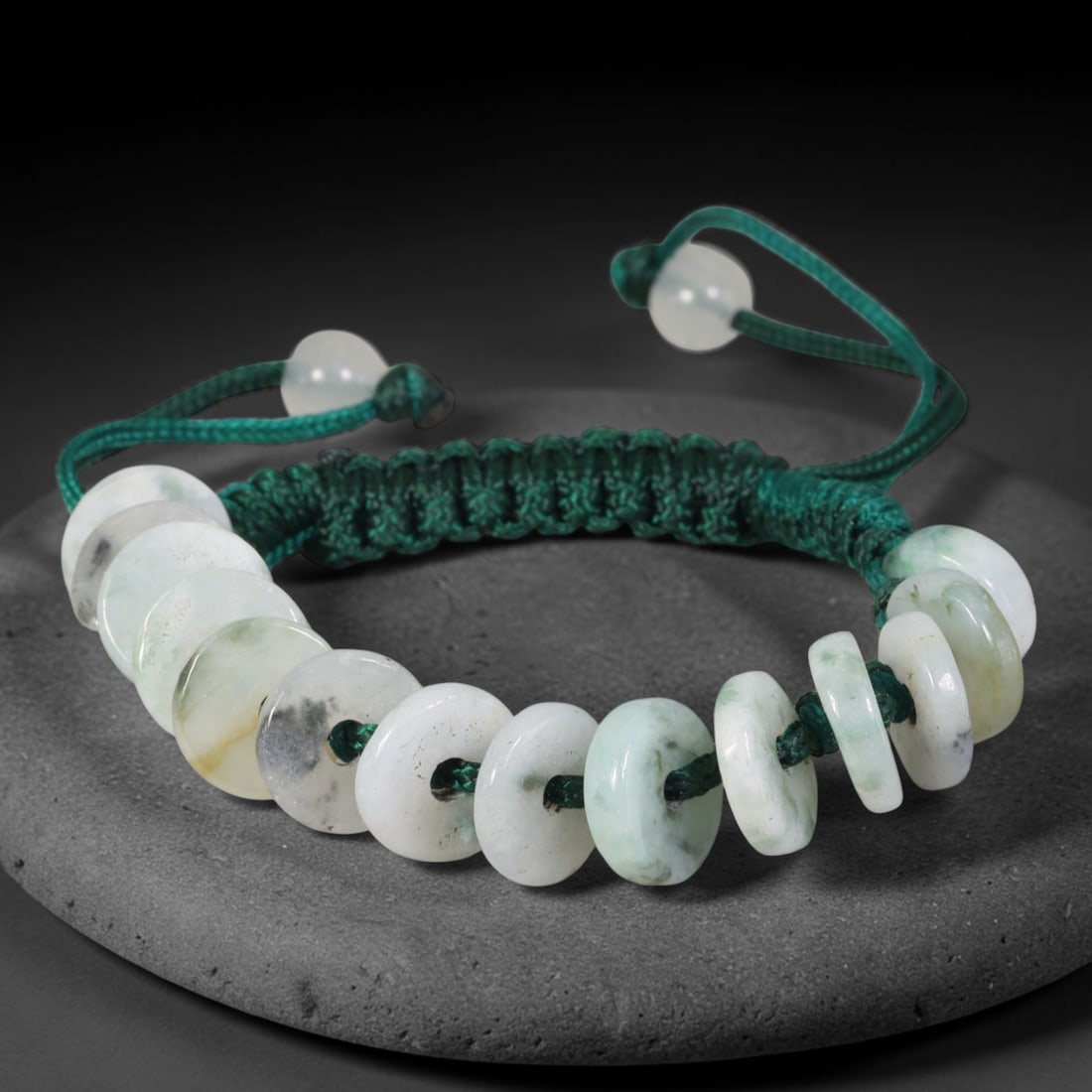 Natural Burmese Type A Pale Green Donut Jadeite Jade Adjustable Braided Bracelet, 57TA: Handcrafted from untreated natural Burmese Type A jadeite, this braided cord bracelet features flat circular donut beads measuring 10.4 mm each, displaying milky pale white base stone naturally streak