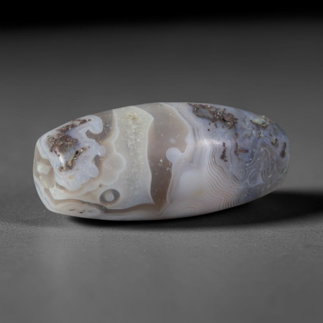 Ancient Sogdian Culture Banded Agate Barrel Bead (500 BCE-800 CE), 60XD: This antique banded agate barrel bead originates from Sogdian Culture, the preeminent Central Asian Silk Road merchant civilization that operated bead trading workshops linking Chinese, Persian, and S