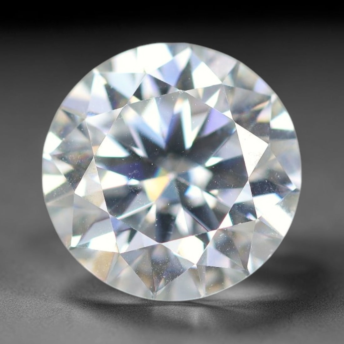 2.50 Carats Clear Moissanite Loose Gemstone, 49WP: This moissanite has dimension measurements of 8.9x5.3mm, a lab produced silicon carbide gem material celebrated for superior refractive index that delivers outstanding light dispersion and vivid spark