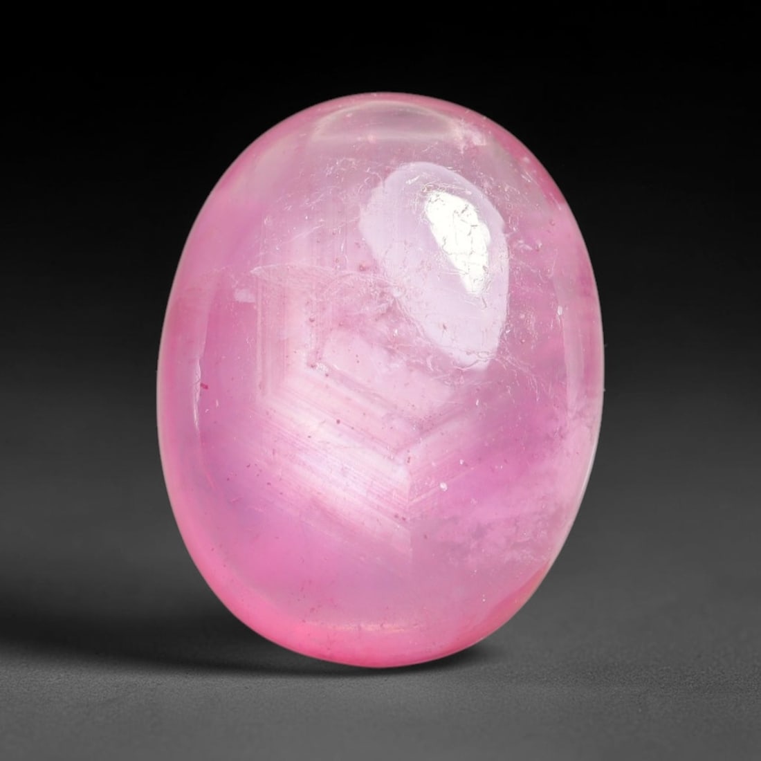 12.17 Carats Natural Mozambique Ruby Cabochon Loose Gemstone, 16XX: This ruby originates from Mozambique natural mineral deposits and receives professional cabochon grinding and polishing treatment to form a smooth glossy exterior surface. Tiny mineral particles and n