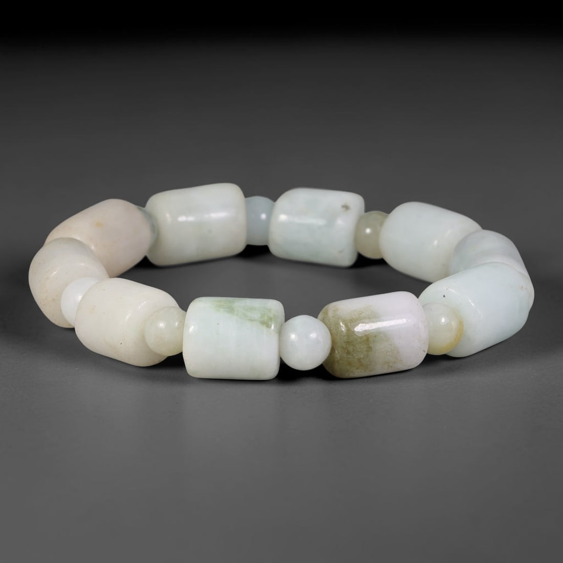 Natural Burmese Type A Multi-Tone Jadeite Jade Beaded Bracelet, 2TA: Crafted from untreated natural Burmese Type A jadeite jade beads with maximum bead dimension of 10.75mm, this wearable strand features a gentle polished finish displaying layered mixed natural mineral