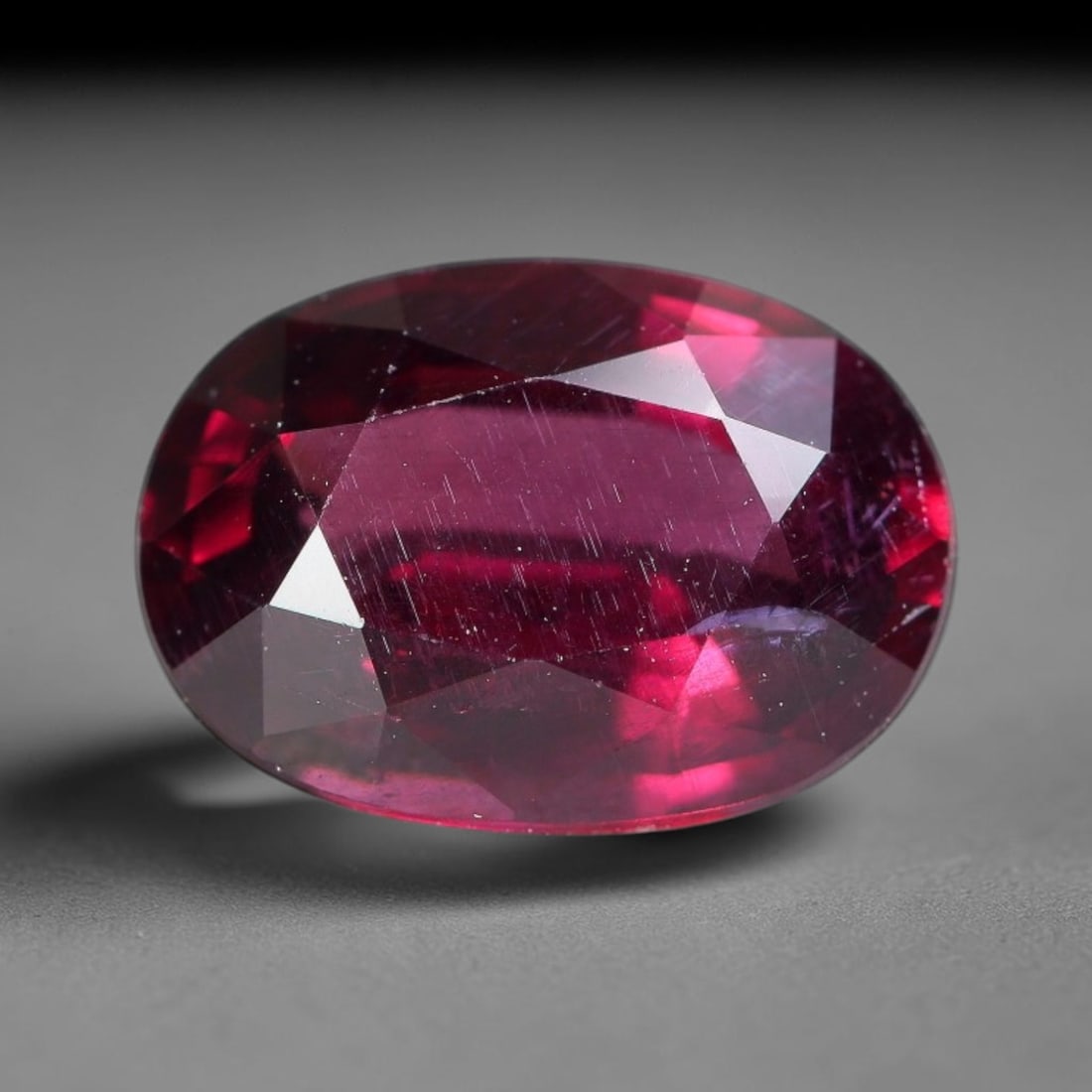 2.52 Carats Natural Deep Burgundy Red Garnet Oval Faceted Loose Gemstone, 70WY: This timeless oval faceted garnet boasts a luxuriously deep burgundy red tone that glows with vivid crimson fire across its precisely polished reflective facets. Fine natural micro mineral specks are 