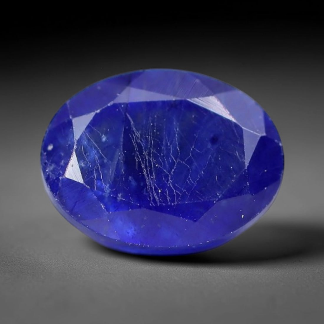 2.20 Carats Royal Blue Sapphire Oval Faceted Loose Gemstone, 11WJ: This classic oval faceted sapphire displays rich saturated royal blue color glowing through crisp polished multi-facet cuts, featuring natural fine internal fissures and tiny scattered mineral micro s