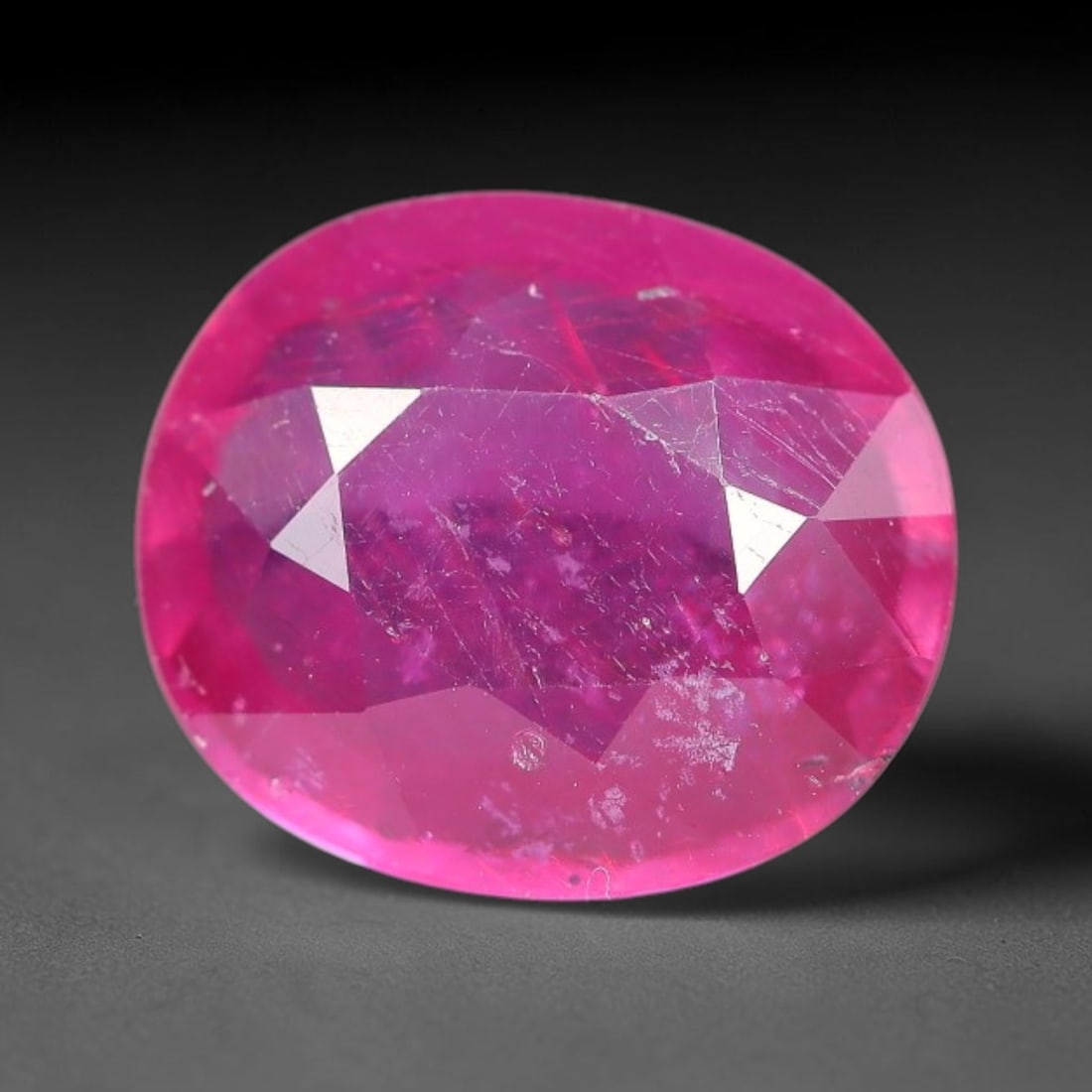 4.51 Carats Natural Mozambique Ruby Oval Faceted Loose Gemstone, 100WY: This natural Mozambique ruby is fashioned with standard oval brilliant faceting, displaying vivid saturated crimson-red hue accompanied by native fine mineral inclusions and subtle trace marks inheren