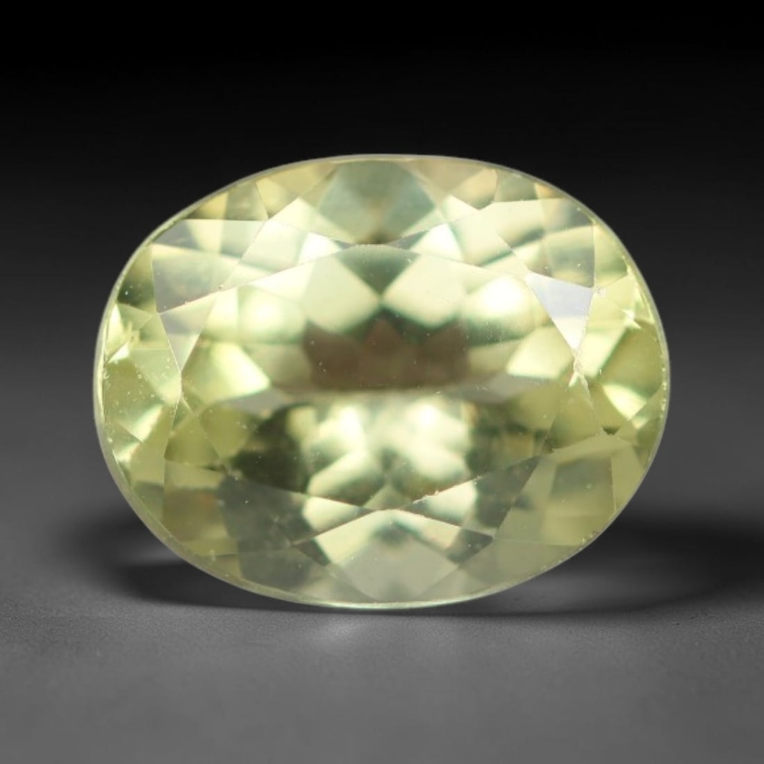 1.87 Carats Natural Pale Yellow Apatite Faceted Loose Gemstone, 44XY: This apatite specimen is sourced from natural geological deposits and shaped with professional faceting and high-gloss polishing work across the outer facet surfaces. Minute internal mineral inclusion