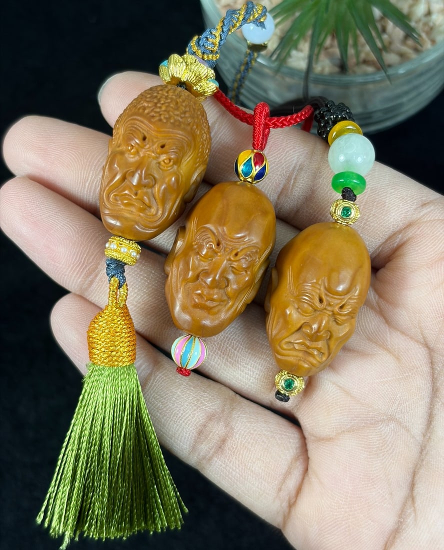 Lot of 3 Hand Carved Olive Nut Arhat Head Pendant Rope Necklaces, 25YJ: This three-piece set features hand-carved olive nut pendants sculpted into detailed arhat head busts with expressive facial textures and fine surface carving, each strung on braided decorative cord ac