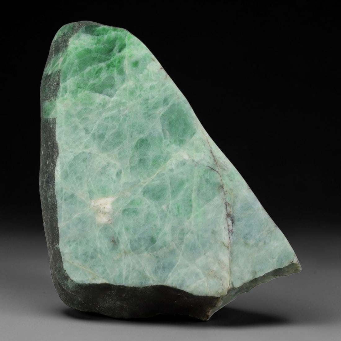 335ct Natural Type A Burmese Jadeite Jade Sliced Rough, 13YK: This specimen is a sliced rough block of natural Type A Burmese jadeite jade. The interior displays natural colour zoning with visible mineral veining and crystalline patterns typical of unprocessed j