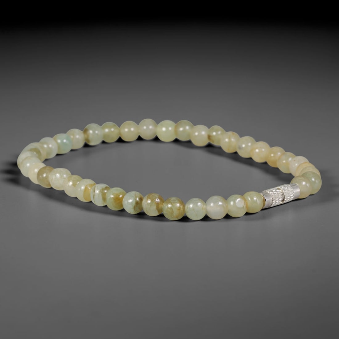 Natural Burmese Type A Pale Honey Cream Jadeite Jade Thin Bracelet with Textured Silver Tube Accent,: Crafted from untreated natural Burmese Type A jadeite jade beads measuring 5.58mm, this ultra-slim delicate bracelet is strung with smooth round beads in soft pale honey cream tones with faint pale mi