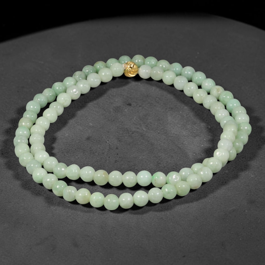 Natural Burmese Type A Uniform Soft Celadon Green Jadeite Jade Beaded Necklace, 27TF: Crafted from natural Burmese type-A jadeite, this beaded necklace consists of smoothly polished round beads measuring 6.4mm. The strand carries consistent soft celadon-green tones with gentle natural 