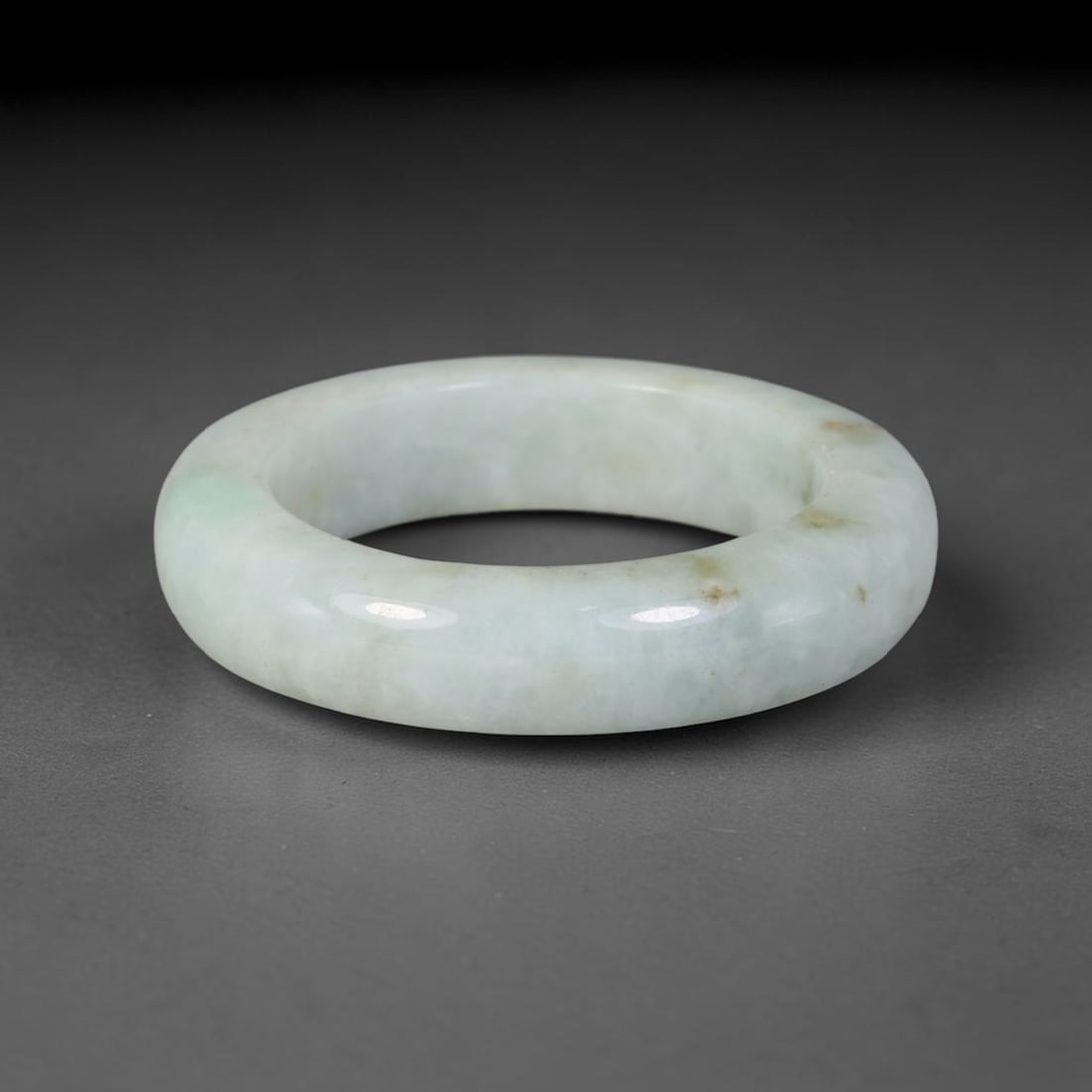 Natural Burmese Type A Jadeite Jade Band Ring Size US 11.5, 46TB: Crafted from untreated natural Burmese Type A jadeite jade, this solid stone band features a high-gloss polished finish displaying consistent deep green mineral tones interwoven with natural subtle to
